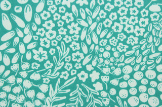 Krisa features a floral and leaf design in white against a blue/green background.  It is perfect for any project where the fabric will be exposed to the weather.  Able to resist stains and water, and has a rating of 15,000 double rubs, UV tested and can withstand 500 hours of direct sunlight  Uses include cushions, tablecloths, upholstery projects, decorative pillows and craft projects. This fabric has a slightly stiff feel but is easy to work with.  