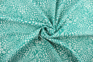 Krisa features a floral and leaf design in white against a blue/green background.  It is perfect for any project where the fabric will be exposed to the weather.  Able to resist stains and water, and has a rating of 15,000 double rubs, UV tested and can withstand 500 hours of direct sunlight  Uses include cushions, tablecloths, upholstery projects, decorative pillows and craft projects. This fabric has a slightly stiff feel but is easy to work with.  