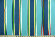 Load image into Gallery viewer, This multi use fabric features a heavy striped design in red, yellow, green blue, white, yellow and turquoise.  It is perfect for outdoor settings or indoors in a sunny room.  It is stain and water resistant and can withstand up to 500 hours of direct sun exposure and has a durability rating of 10,000 double rubs.  Uses include decorative pillows, cushions, chair pads, tote bags and upholstery.
