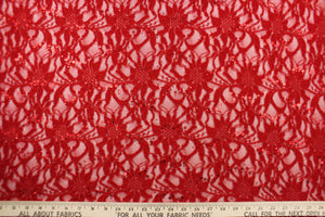 This lace features a sequin floral design in a rich red with a stretch.