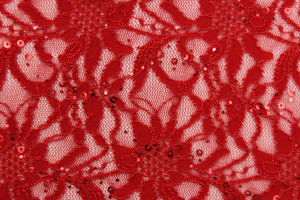 This lace features a sequin floral design in a rich red with a stretch.