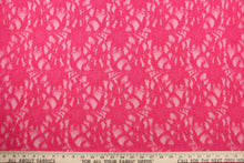 Load image into Gallery viewer,  This lace features a ornamental design in a beautiful rich pink with a stretch. 
