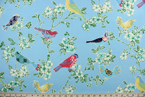 Tweet Toile is an outdoor fabric featuring various colored birds perched on flowering tree branches. 