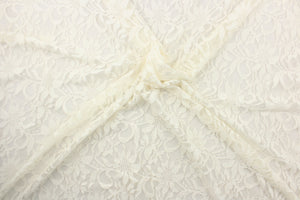 This lace features a floral design in cream a with a stretch