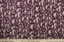 Load image into Gallery viewer, This lace features a floral design with glitter in a plum purple with a stretch. 

