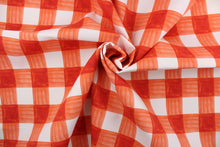 Load image into Gallery viewer,  Painterly Plaid is perfect for outdoor environments.  It features a classic buffalo check pattern in the shades of coral and white, and has a durability rating of 13,000 double rubs. This upholstery fabric is stylish, sturdy, and sure to stand the test of time.  Uses include cushions, tablecloths, upholstery projects, decorative pillows and craft projects. This fabric has a slightly stiff feel but is easy to work with.  
