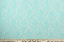 Load image into Gallery viewer, This lace features a floral design in a beautiful blue green with a stretch.
