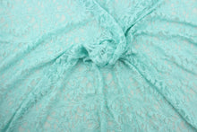Load image into Gallery viewer, This lace features a floral design in a beautiful blue green with a stretch.
