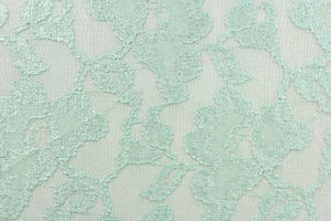 This lace features a floral design in a mint green with a stretch.