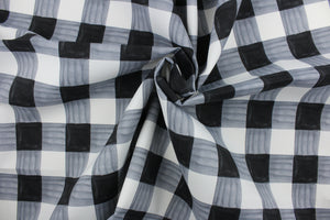 Painterly Plaid is perfect for outdoor environments.  It features a classic buffalo check pattern in the shades of black and white, and has a durability rating of 13,000 double rubs. This upholstery fabric is stylish, sturdy, and sure to stand the test of time.  Uses include cushions, tablecloths, upholstery projects, decorative pillows and craft projects. This fabric has a slightly stiff feel but is easy to work with.  