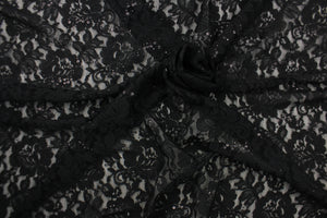 This lace features a floral sequin design in black with a stretch. 