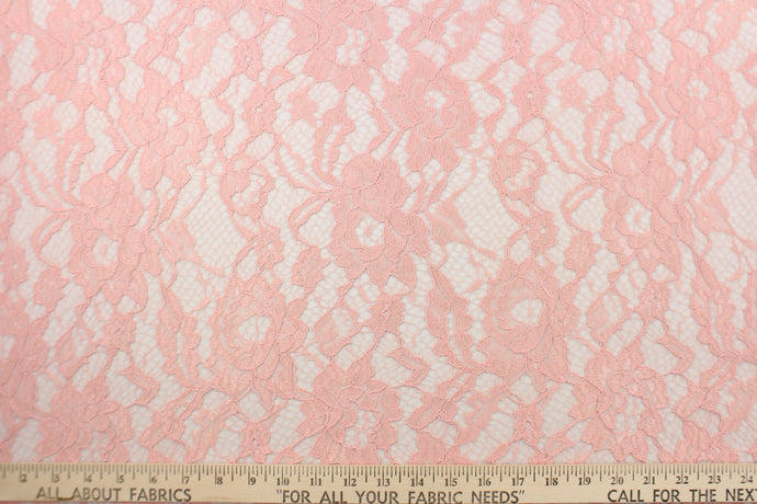 This net lace features a floral design in a beautiful pink with a stretch. 