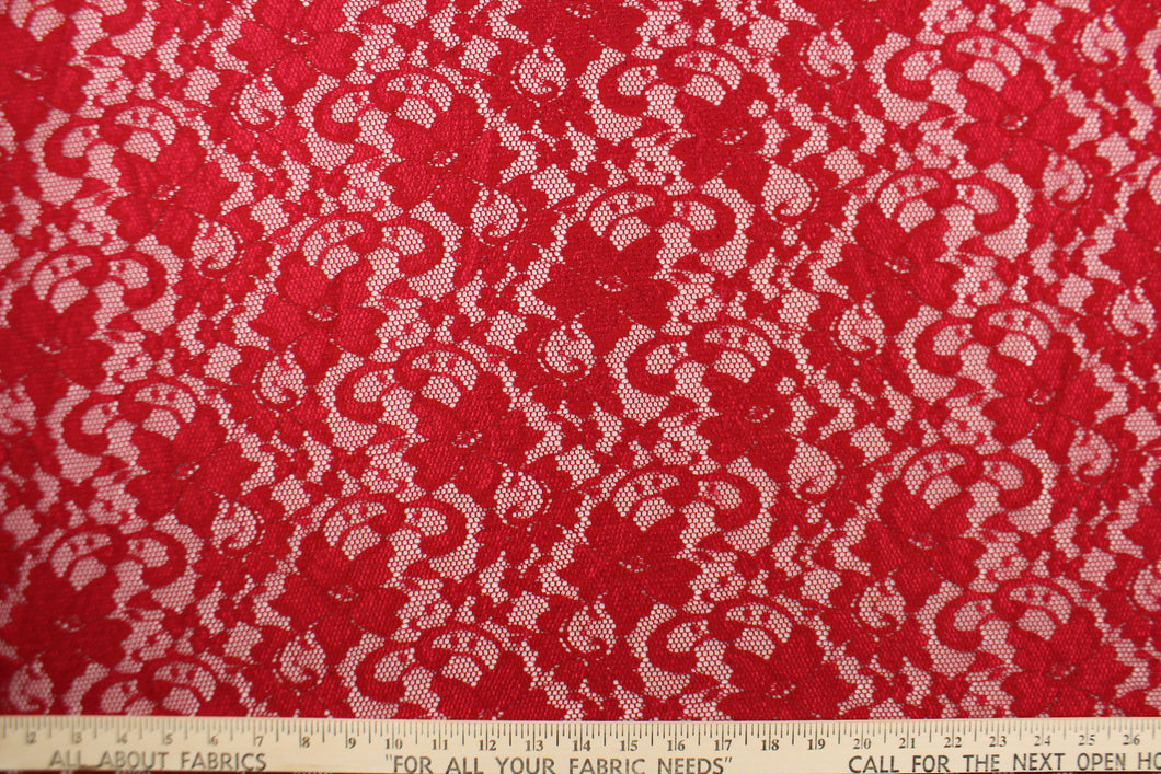This lace features a floral design in a rich red with a stretch. 