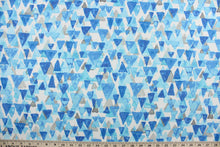 Load image into Gallery viewer,  Reef Point features layered cascading triangles in shades of blue and gray against a white background.  It is perfect for any project where the fabric will be exposed to the weather.  Able to resist stains and water and can withstand 500 hours of direct sunlight.  Strong and durable with a rating of 51,000 double rubs.  Uses include cushions, tablecloths, upholstery projects, decorative pillows and craft projects. This fabric has a slightly stiff feel but is easy to work with.  

