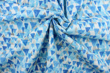 Load image into Gallery viewer,  Reef Point features layered cascading triangles in shades of blue and gray against a white background.  It is perfect for any project where the fabric will be exposed to the weather.  Able to resist stains and water and can withstand 500 hours of direct sunlight.  Strong and durable with a rating of 51,000 double rubs.  Uses include cushions, tablecloths, upholstery projects, decorative pillows and craft projects. This fabric has a slightly stiff feel but is easy to work with.  
