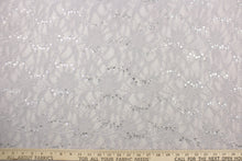 Load image into Gallery viewer, This lace features a floral sequin design in a silver or gray with a stretch. 
