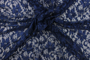  This lace features a floral design in a rich navy blue with a stretch.