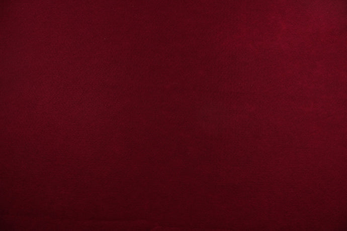 This is a felt fabric in solid garnet.  It features a slightly textured feel that is soft, sturdy and durable.  Uses include crafts, apparel accents, décor, embellishments and more. 