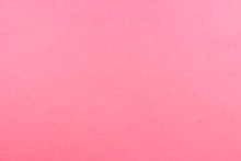 Load image into Gallery viewer, This is a felt fabric in solid hot pink. It features a slightly textured feel that is soft, sturdy and durable.  Uses include crafts, apparel accents, décor, embellishments and more. 
