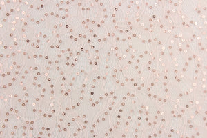 This lace features a sequin floral design in a  light pink with a stretch. 