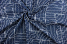 Load image into Gallery viewer,  Kathu is an embroidered fabric featuring a geometrical design in midnight blue and white.  It is stable and durable with 18,000 double rubs.  Uses include drapery, pillows, light upholstery, table runners, bedding, headboards, home décor and apparel. 
