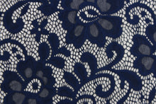 Load image into Gallery viewer, This lace features a floral design in a rich navy blue with a stretch. 
