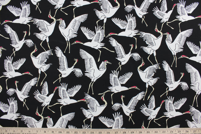 This screen printed fabric features cranes in white against an ebony background.  Perfect for any project where the fabric will be exposed to the weather.  It is fade resistant and features a water repellant finish with a rating of 33,000 double rubs.  Uses include cushions, tablecloths, upholstery projects, decorative pillows and craft projects. This fabric has a slightly stiff feel but is easy to work with.  