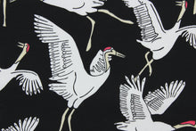Load image into Gallery viewer, This screen printed fabric features cranes in white against an ebony background.  Perfect for any project where the fabric will be exposed to the weather.  It is fade resistant and features a water repellant finish with a rating of 33,000 double rubs.  Uses include cushions, tablecloths, upholstery projects, decorative pillows and craft projects. This fabric has a slightly stiff feel but is easy to work with.  
