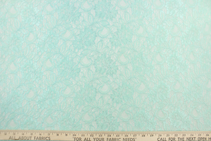This lace features a floral design in a beautiful mint green with a stretch. 