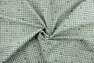 Axel is a multi use fabric featuring a geometrical design in evergreen and white with a soil and stain repellant finish.  It can be used for several different statement projects including window accents (drapery, curtains and swags), decorative pillows, hand bags, bed skirts, duvet covers, upholstery and craft projects.  It has a soft workable feel yet is stable and has a durability rating of 51,000 double rubs.