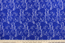 Load image into Gallery viewer, This lace features a floral design in a rich royal blue with a stretch. 
