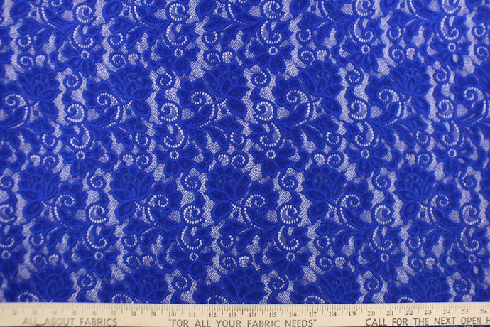This lace features a floral design in a rich royal blue with a stretch. 