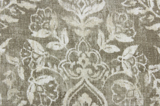 Bonaire is a multi purpose fabric featuring a large frame design in light taupe and cream. The versatile fabric is perfect for window accents (draperies, valances, curtains and swags) cornice boards, accent pillows, bedding, headboards, cushions, ottomans, slipcovers and upholstery.  It has a soft workable feel yet is stable and durable with 10,000 double rubs.  