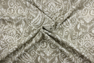 Bonaire is a multi purpose fabric featuring a large frame design in light taupe and cream. The versatile fabric is perfect for window accents (draperies, valances, curtains and swags) cornice boards, accent pillows, bedding, headboards, cushions, ottomans, slipcovers and upholstery.  It has a soft workable feel yet is stable and durable with 10,000 double rubs.  