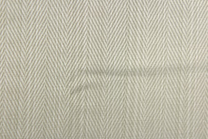 This beautiful  fabric features a herringbone design in a silver tone.