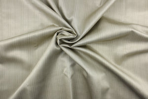 This beautiful  fabric features a herringbone design in a silver tone.