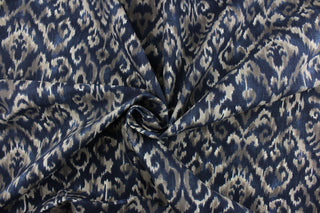 Komodo features a beautiful ikat design in navy blue and brown.  The versatile fabric is perfect for window accents (draperies, valances, curtains and swags) cornice boards, accent pillows, bedding, headboards, cushions, ottomans, slipcovers and upholstery.  It has a soft workable feel yet is stable and durable with 50,000 double rubs.