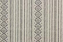 Load image into Gallery viewer, Bindu is a multi purpose fabric featuring a striped Aztec design.  The versatile fabric is perfect for window accents (draperies, valances, curtains and swags) cornice boards, accent pillows, bedding, headboards, cushions, ottomans, slipcovers and upholstery.  It has a soft workable feel yet is stable and durable. Colors included are deep green, dark brown and stone.
