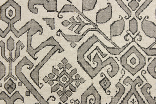 This fabric features an Aztec design in gray, black and natural. 