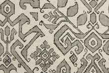 Load image into Gallery viewer, This fabric features an Aztec design in gray, black and natural. 
