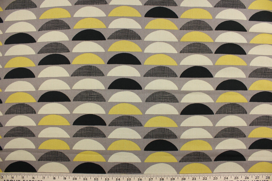  This fabric features various large scale half-circles screen printed on 100% cotton duck.  Colors included are black, yellow gold and beige on a taupe background.  The multi use fabric is perfect for window treatments, decorative pillows, custom cushions, bedding, light duty upholstery applications and almost any craft project.  This fabric has a soft workable feel yet is stable and durable with 50,000 double rubs.