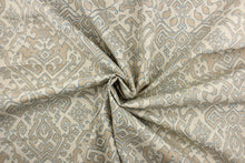 Load image into Gallery viewer, This fabric features an Aztec design in blue, taupe and natural .
