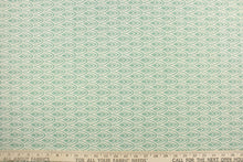 Load image into Gallery viewer, This fabric features a geometric design in a beautiful seafoam or spa green and natural .
