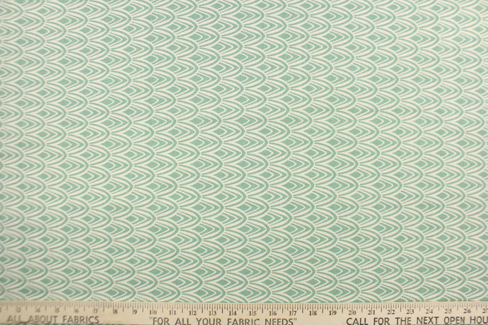 This fabric features a geometric design in a beautiful seafoam or spa green and natural .