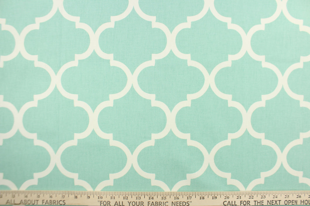 This fabric features a geometric lattice design in spa blue . 