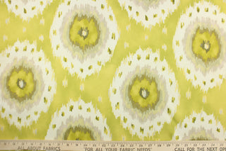 This fabric features a Ikat design in lime green, yellow, olive green, dull white, silver, pale khaki, and pale green. 