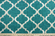 Load image into Gallery viewer,  This fabric features a geometric design in teal, white, and taupe .
