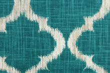 Load image into Gallery viewer,  This fabric features a geometric design in teal, white, and taupe .
