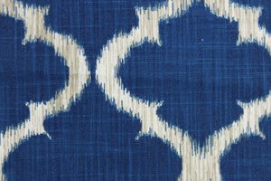 This fabric features a geometric design in rich blue, white and taupe.