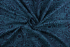 Lagos is a multi use jacquard fabric featuring a geometric design in teal against a navy blue background.  It is durable and would be great for upholstery, bedding, cornice boards, accent pillows and window treatments.